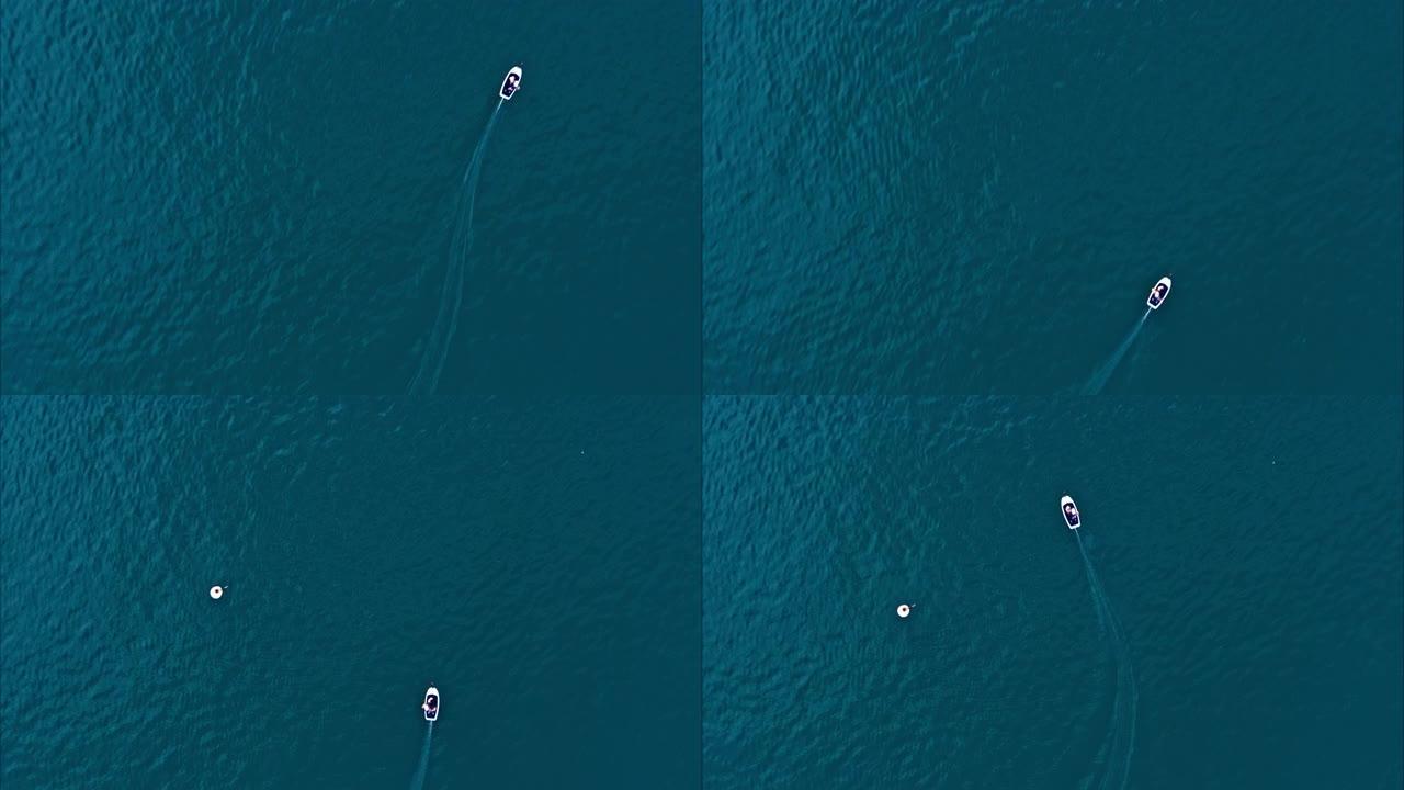 在大西洋骑机动冲浪板的人。在冲浪板之后，带有平移摄像机运动的航拍视频。