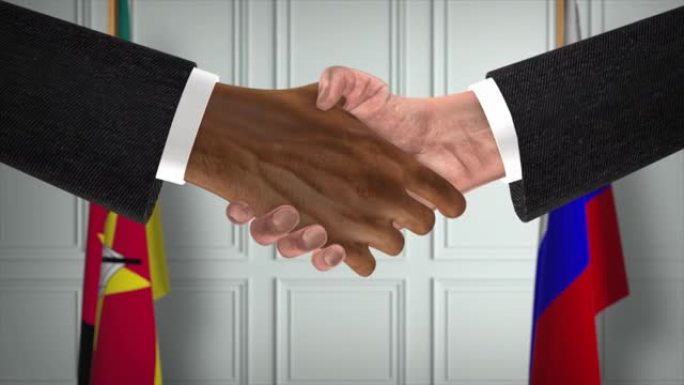 莫桑比克与俄罗斯协议握手，政治例证。正式会议或合作，商务见面。商人和政客握手