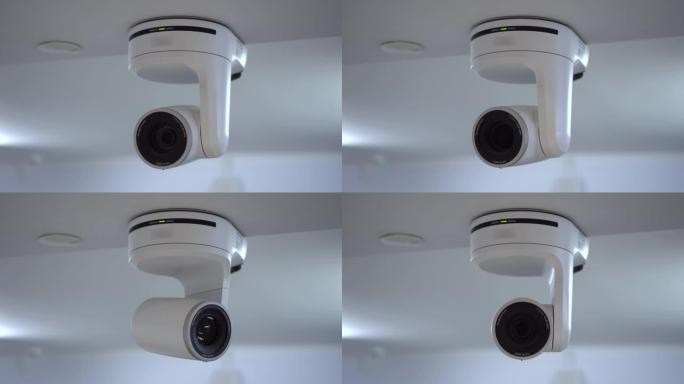 遥控电动摄像机向不同方向移动，使用变焦。用于直播和视频录制的天花板安装摄像机。4k