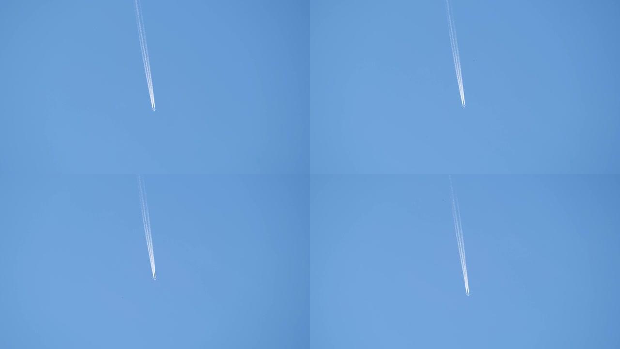 遥远的客机在晴朗的蓝天上高空飞行，留下白烟痕迹。航空运输概念