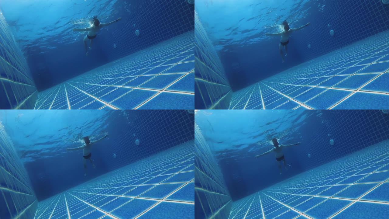 穿着泳装的高加索人的背景图漂浮在私人游泳池边的表面上，享受着这个过程