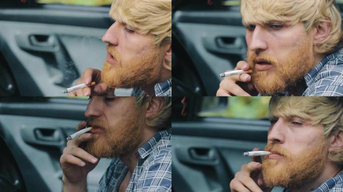 一个留着胡子的男人在车里抽烟。在站立的汽车中吸烟的特写镜头。吸入并从嘴里释放烟雾