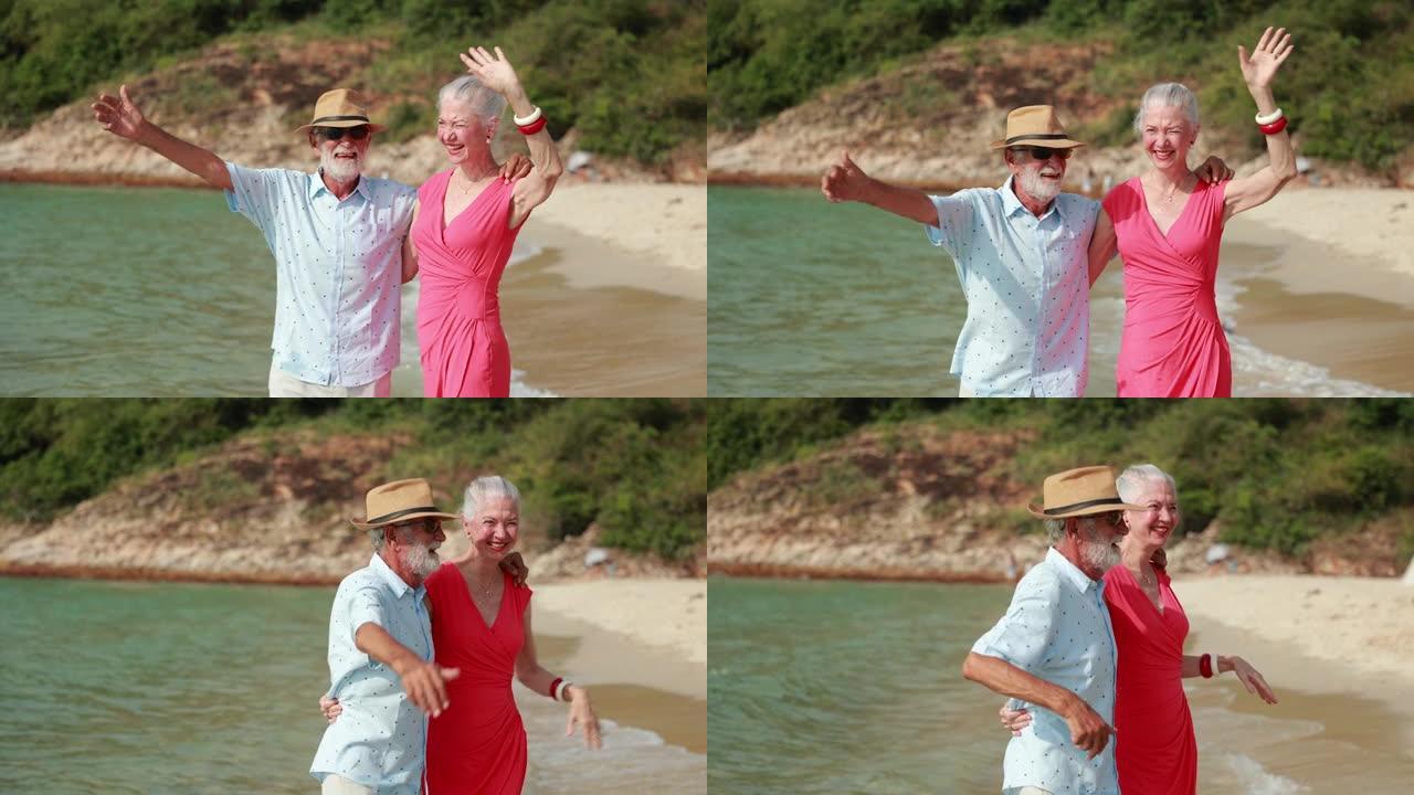 慢动作。戴着时尚太阳镜的一对老年夫妇在海滩上聊天，看着坐在椅子上的天空。假期旅行暑假。