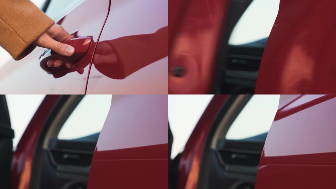 一名妇女将她的手带到红色的汽车门把手上并将其打开