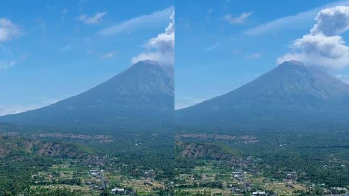 岛屿海岸的垂直视频，背景为黑沙滩和火山爆发