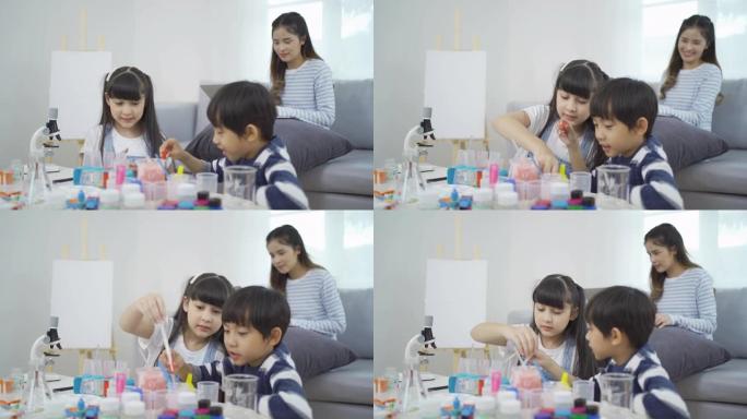 一群亚洲学生的孩子学习，在实验室或实验室学习试管在学校，医学，化学。实验科学。课堂教育。人们的生活方