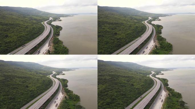 城市之间的高速公路，鸟瞰图，高速公路的高角度视图穿过湖泊和山脉