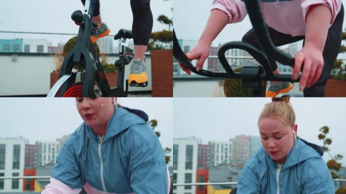 运动女孩在屋脊上骑固定自行车进行有氧骑行训练练习