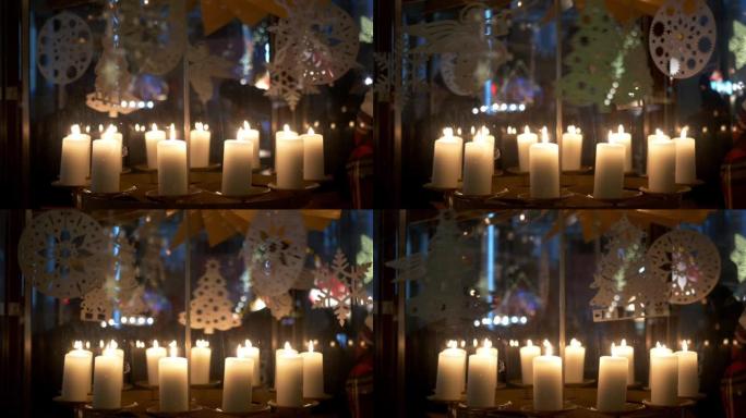 降临节白色蜡烛上的旋转装饰由胶合板制成，描绘天使或圣诞树10