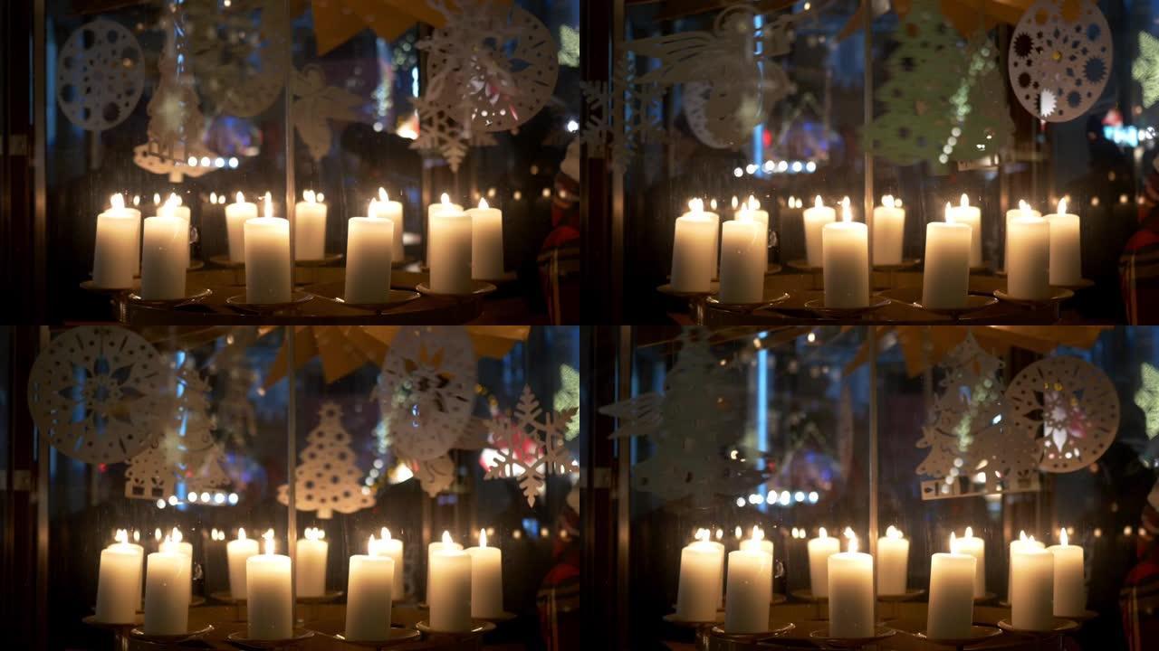降临节白色蜡烛上的旋转装饰由胶合板制成，描绘天使或圣诞树10