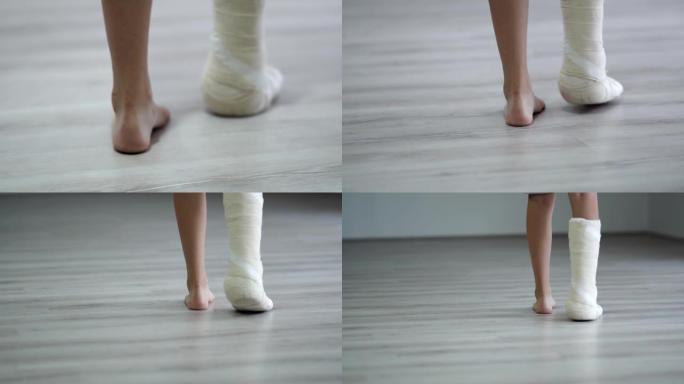 走路时使用拐杖的石膏石膏中的女人腿特写