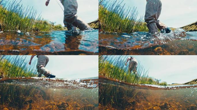 渔夫水下景观。垂钓者穿着涉水靴在一条急流的河底滑滑的岩石底部行走
