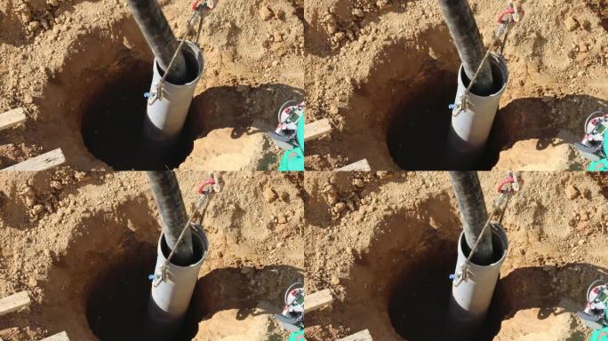 水泥泵送软管正在将水泥泵入深基坑