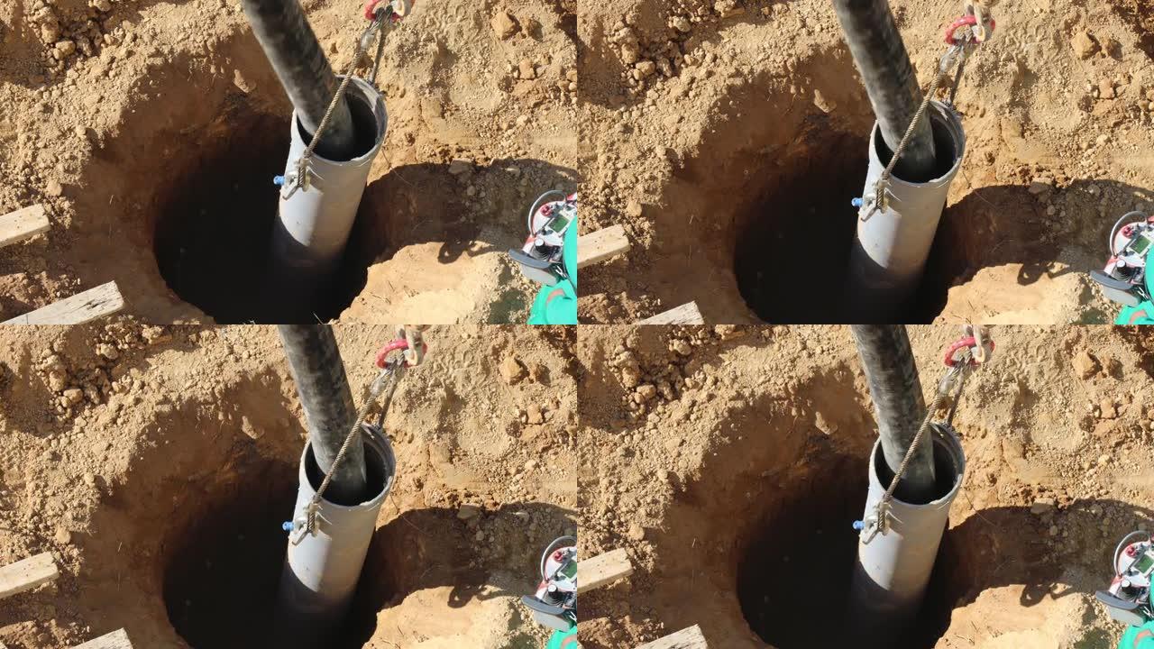 水泥泵送软管正在将水泥泵入深基坑