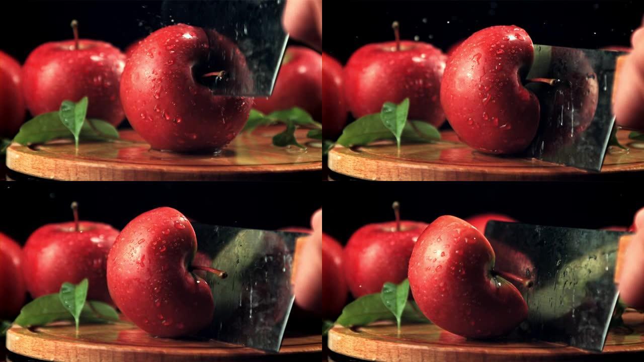 用大刀将成熟的苹果切成两半。拍摄的是1000 fps的慢动作。