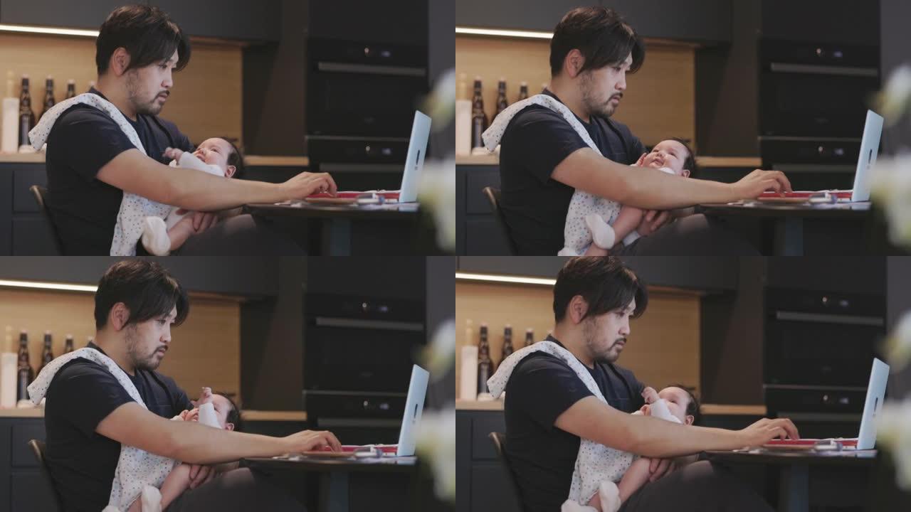 父亲抱着女婴工作父亲抱着女婴工作
