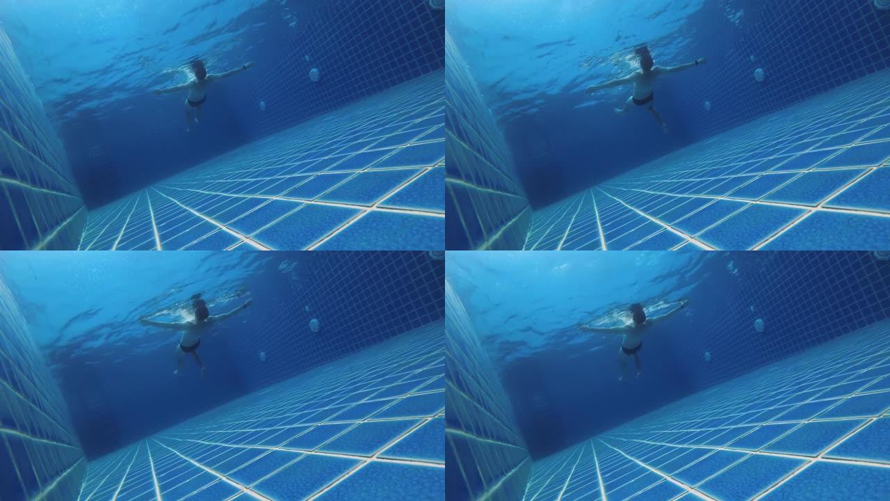 男人在游泳池里放松漂浮在背上，腿和胳膊在慢动作中划水