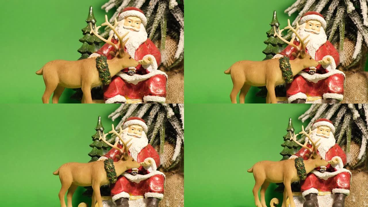 一个漂亮的陶瓷玩具，形状是圣诞老人和绿色背景上的鹿。