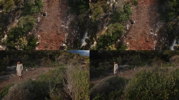 2个剪辑!一个年轻女子走路的鸟瞰图。梅诺卡岛-西班牙4K