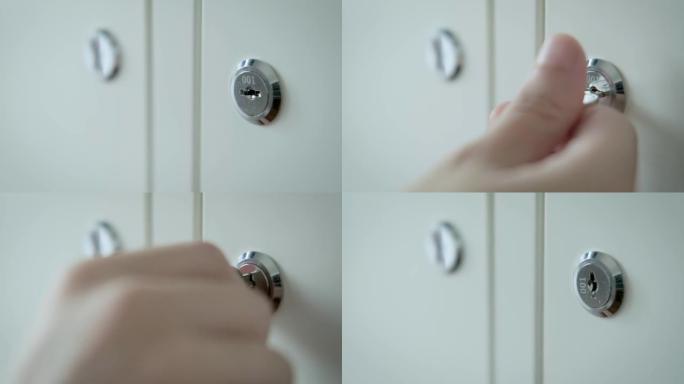 男人的手握着锁上柜门的钥匙。秘密存储概念