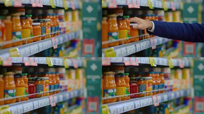 男人在食品店选择番茄酱，从超市货架上拿走罐子，特写镜头，4K，Prores