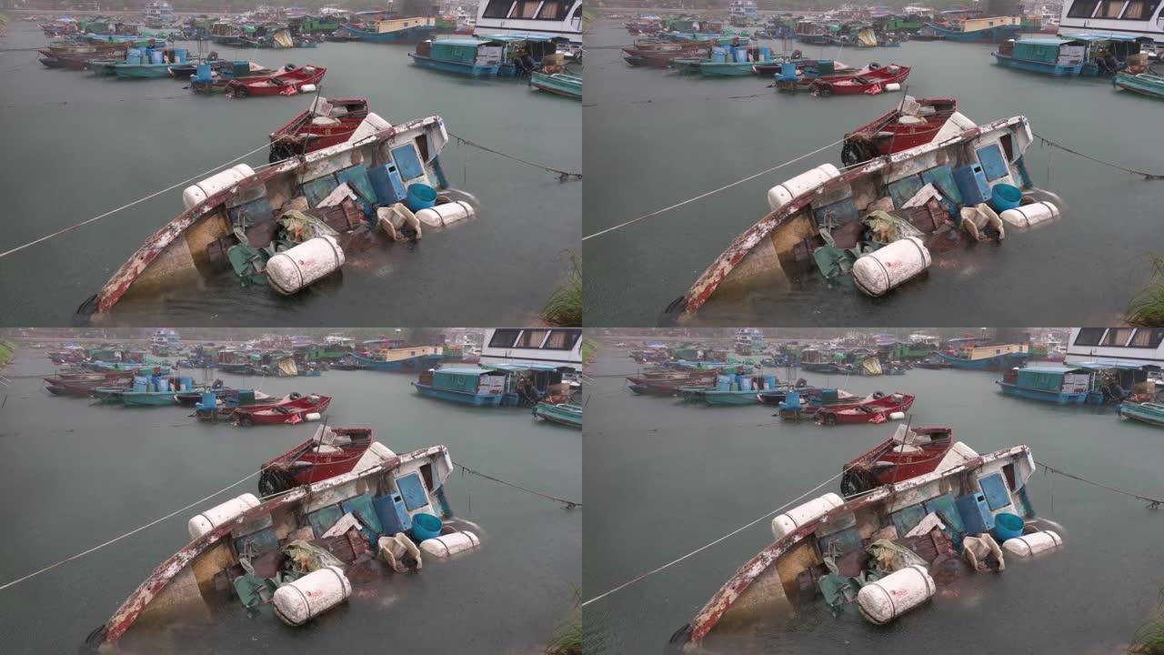 一艘渔民的渔船在暴雨中被淹没，在强烈热带台风信号T8 Ma-On期间，持续风速达63英里(101公里