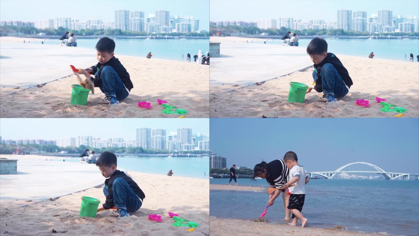 带孩子海边玩沙