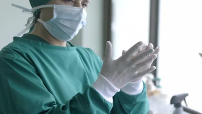 医生戴上手术手套，为手术和体检提供专业的医疗安全和卫生。