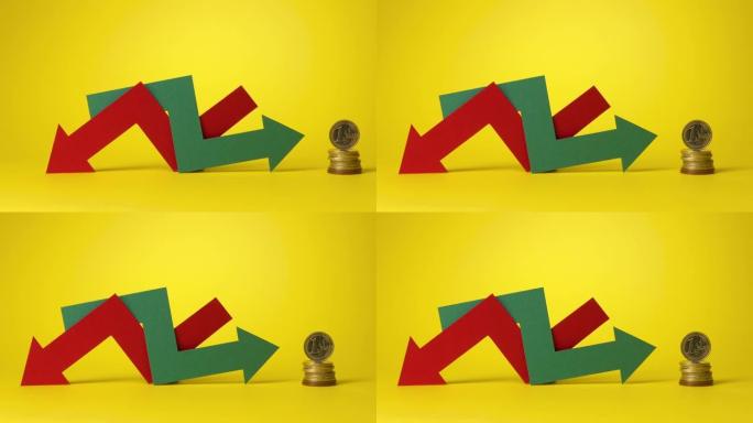 黄色背景上的一堆欧元硬币。红色和绿色箭头交织在一起。经济增长或全球衰退。