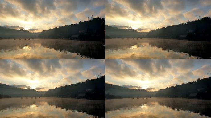 早晨日出船漂流在湖面上移动的雾中野生自然慢动作