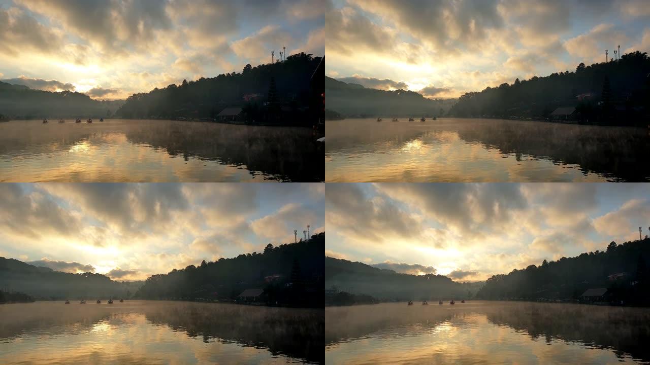 早晨日出船漂流在湖面上移动的雾中野生自然慢动作