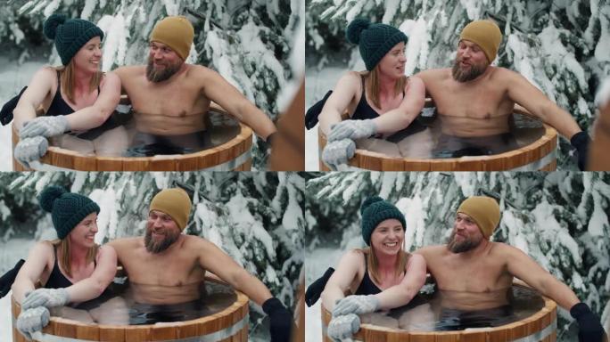 白人妇女和男人在冬季用冷冻水洗澡时。用8k的红氦相机拍摄。