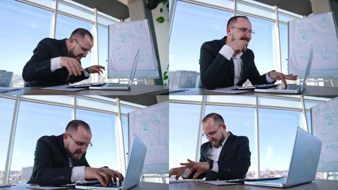 有趣的商人在笔记本电脑上打字。戴着眼镜的办公室工作人员坐在工作场所的办公桌前，发疯。业务中的问题
