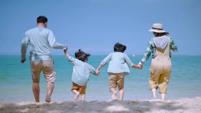 亚洲家庭在度假放松，家庭关系概念，旅行，放松的海滩上愉快地戏弄。