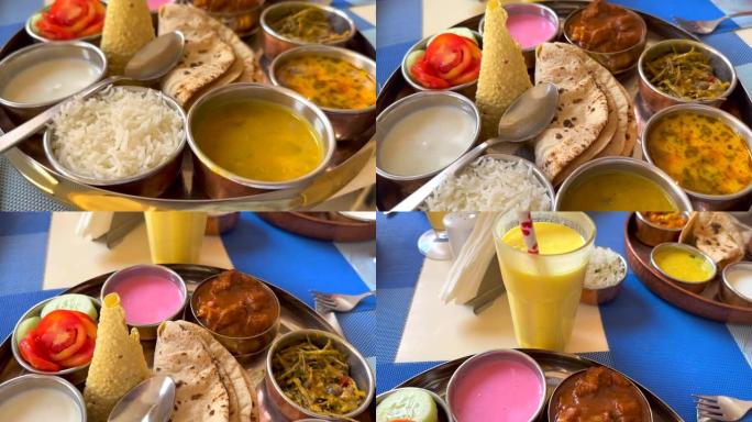 印度-碗和拉西中的食物