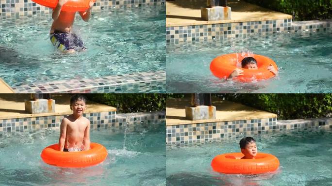 亚洲男孩用智能手机在游泳池玩水下游泳