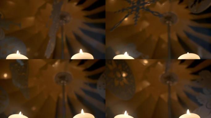 降临节白色蜡烛上的旋转装饰由胶合板制成，描绘天使或圣诞树12p11