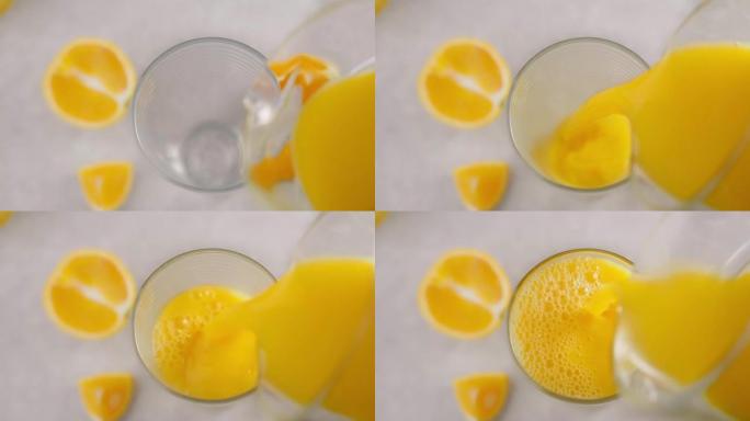 倒入玻璃杯中的新鲜橙汁