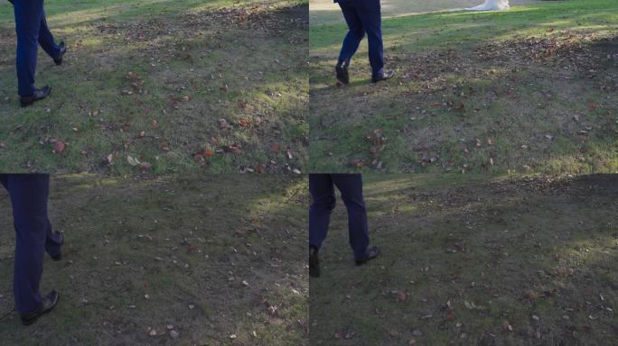 穿着皮鞋的人走在草地上