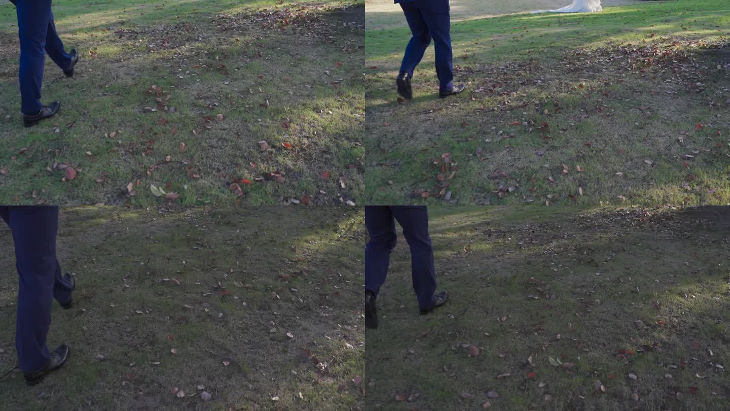 穿着皮鞋的人走在草地上