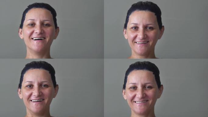 在covid大流行期间，一位微笑着的女人的肖像，头发染成黑色，在家里染发