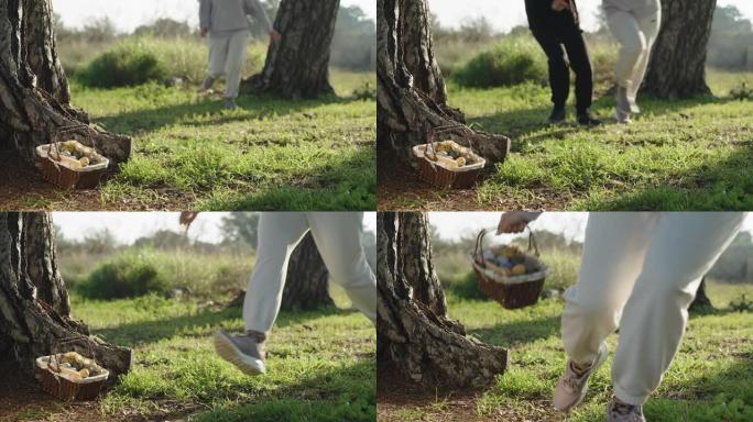 森林里的一男一女竞相吃一篮子复活节彩蛋，