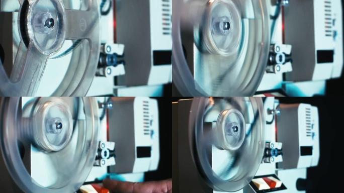 旧胶卷相机上的变焦投影是由一个男人用手开始的，然后过一会儿就停止了