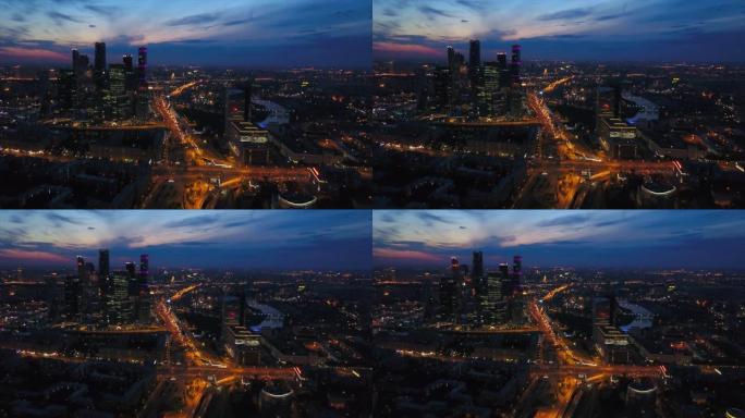 俄罗斯日落夜照明现代莫斯科市交通道路空中全景4k