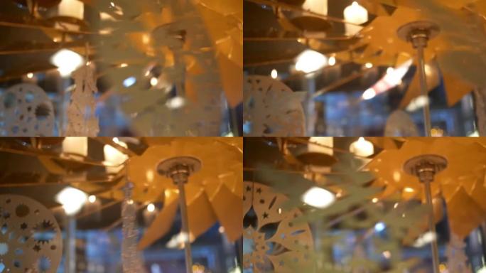 降临节白色蜡烛上的旋转装饰由胶合板制成，描绘天使或圣诞树09