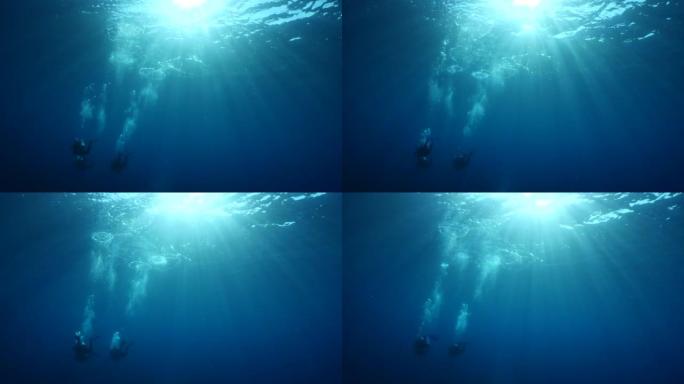 水下水肺潜水员与阳光和阳光在海洋风景水下剪影潜水员