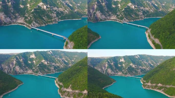黑山的皮瓦湖上的桥与峡谷山脉的鸟瞰图。
