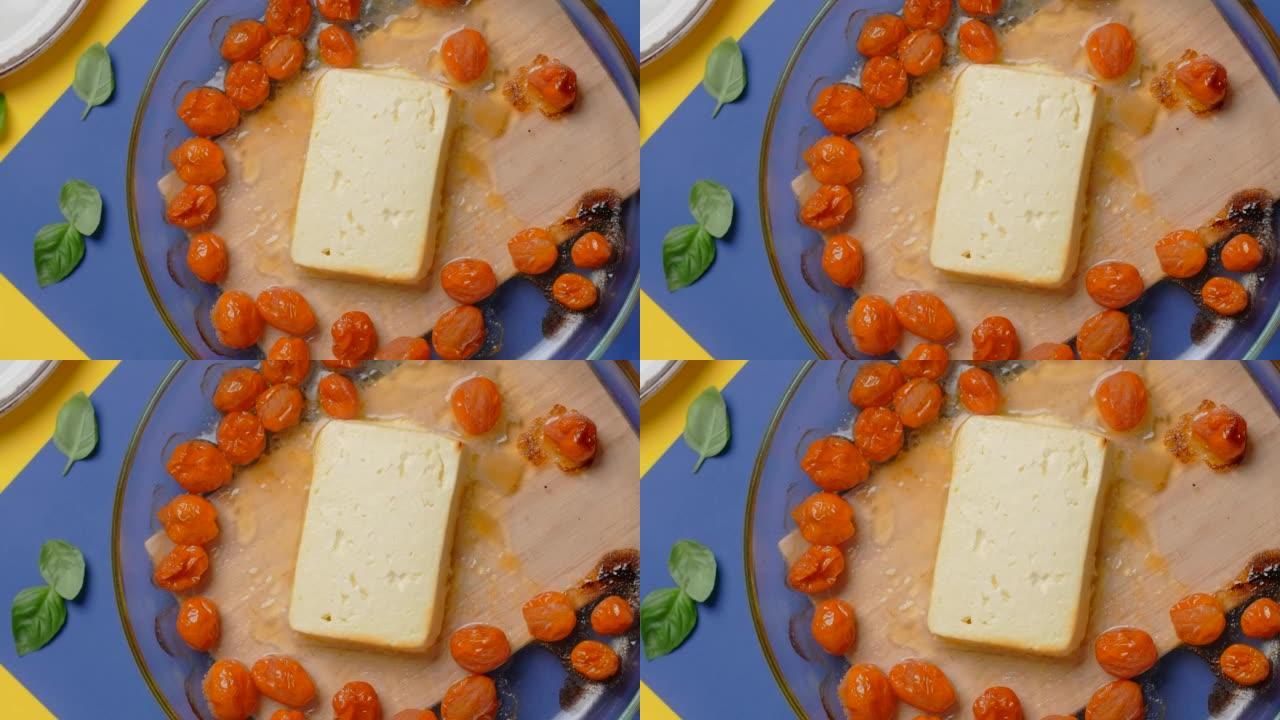 垂直平放视频: 厨师把盘子里放着热烤的西红柿和羊乳酪