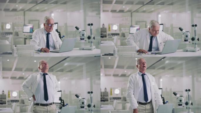 一位科学家使用笔记本电脑并在现代实验室中看起来压力很大的4k视频片段