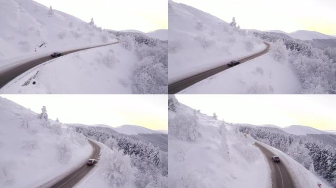 冬季在通往山区的道路上追逐黑色汽车